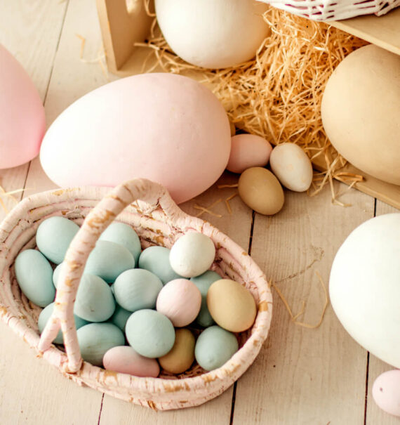 Easter basket filled with pastel coloured eggs