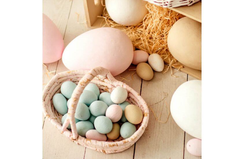 Easter basket filled with pastel coloured eggs