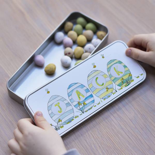 Easter tin filled with mini eggs with hand-painted striped Easter egg illustrations